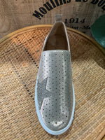 Gold slip shoe on silver star detail